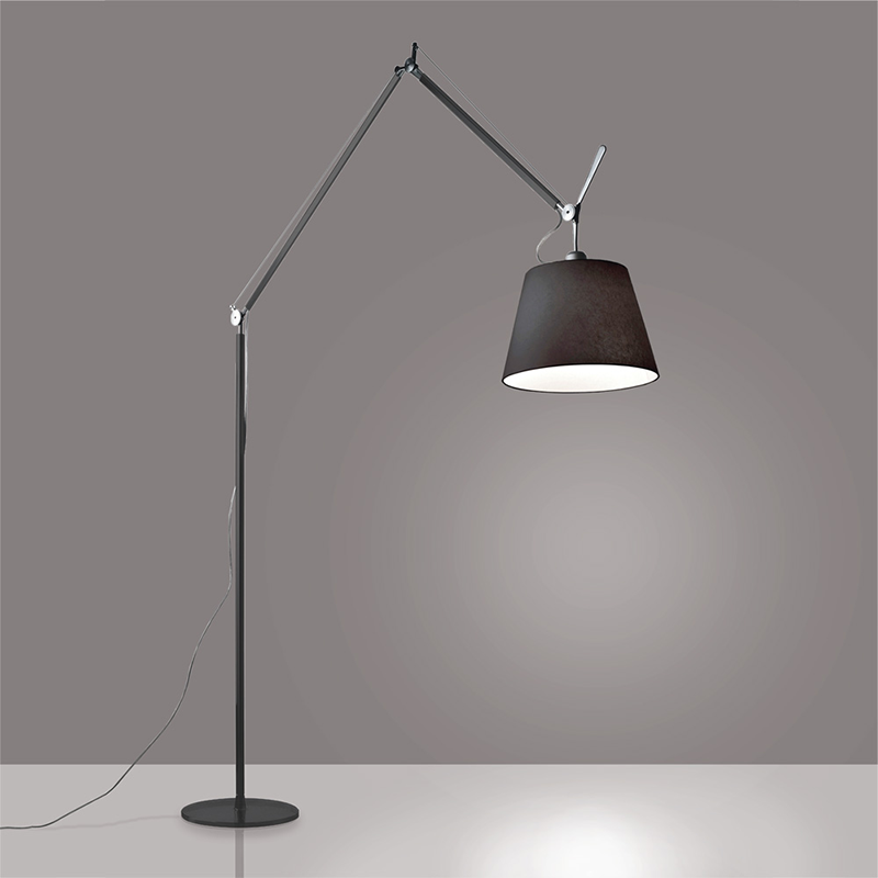 The Tolomeo Mega Floor Lamp, Black from Artemide in black in a study room.