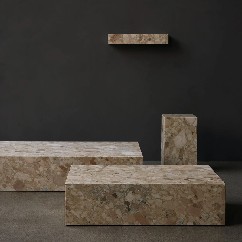 All models of the Plinth Collection in Kunis Breccia Marble. Shown here marble coffee table, marble plinth, marble floating wall shelf