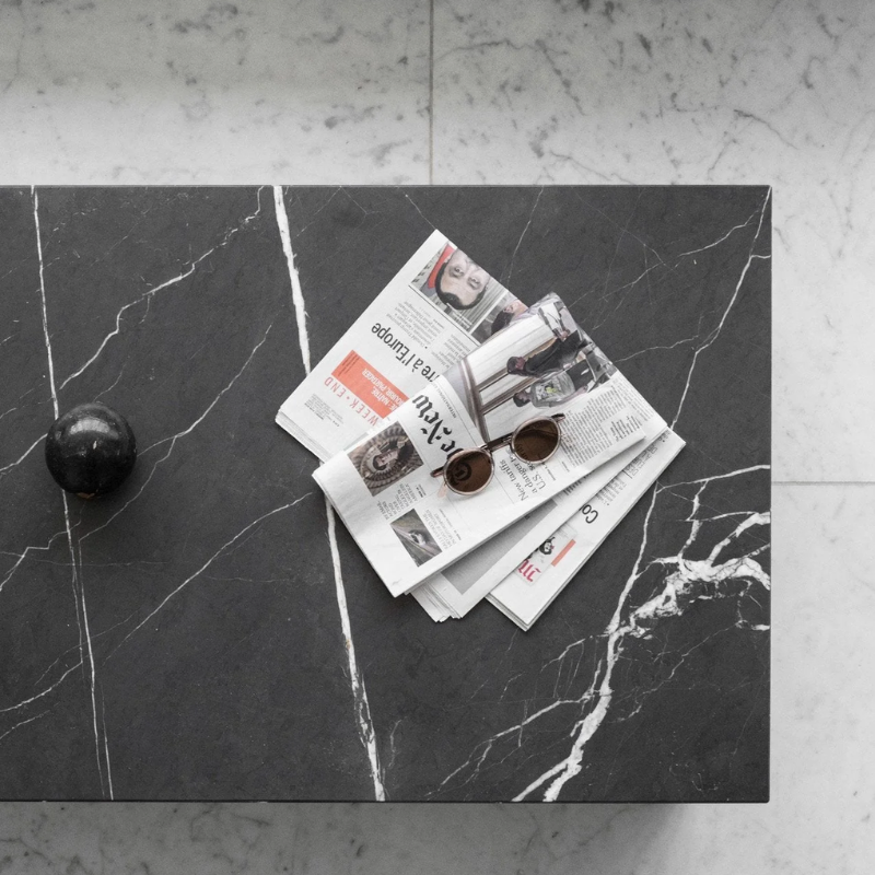 Black marble coffee table in a living room