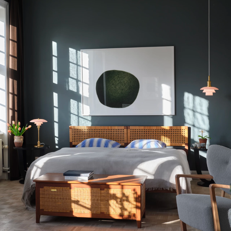 the PH 3/3 Pale Rose Pendant boasts beautiful, mouthblown pale rose glass shades, that are sandblasted on the underside to provide optimal light.