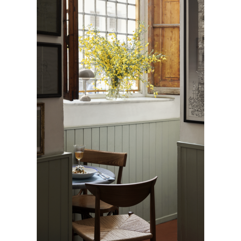 The Flowerpot VP9 Portable Table Lamp from &Tradition in a dining room.