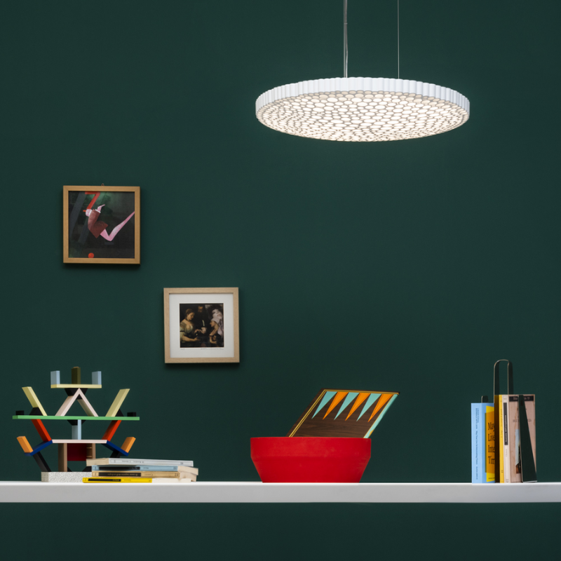 This is the Calipso Suspension pendant light from Artemide in an office space.