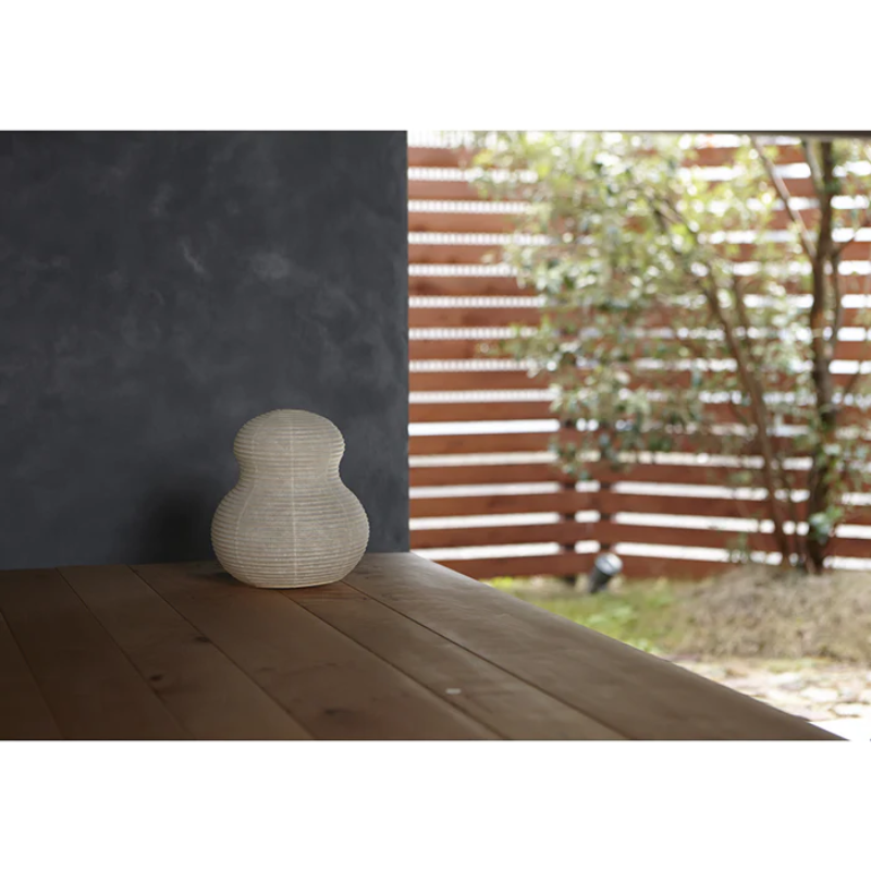 The Paper Moon 2 from Asano turned off, outside in a garden.