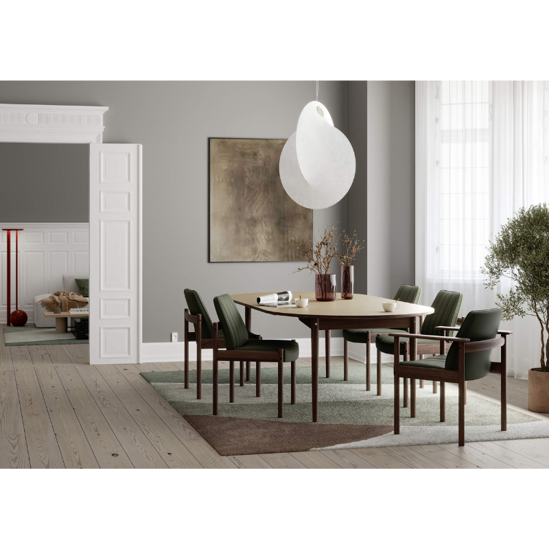 The Extendable Oma Dining Table from Eikund of Norway in a living room.