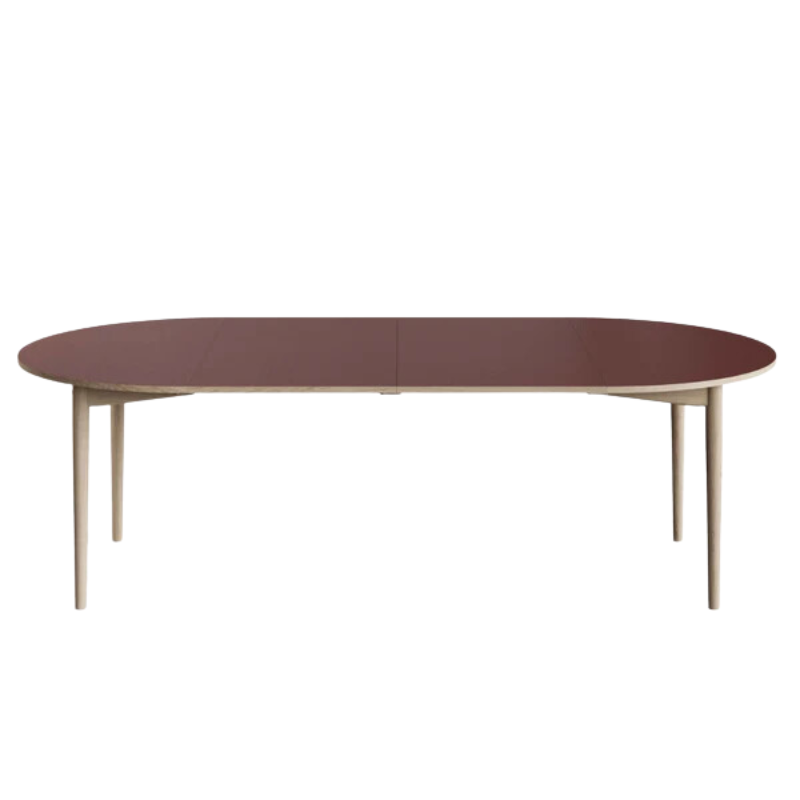 The Extendable Oma Dining Table from Eikund of Norway in a studio.