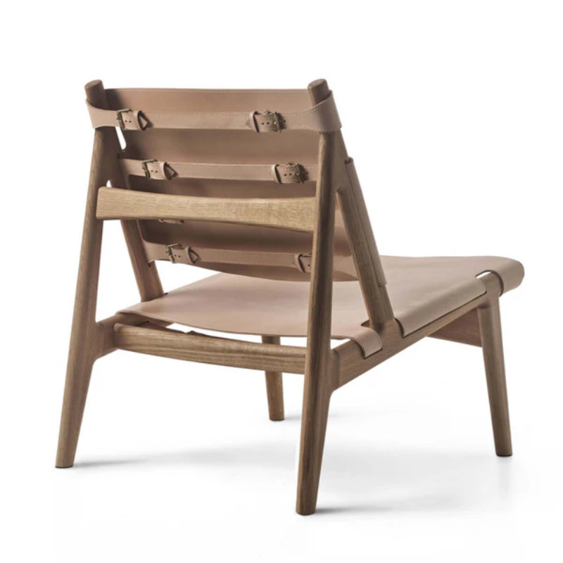 The Hunter Lounge Chair from Eikund of Norway in natural leather from a rear angle.
