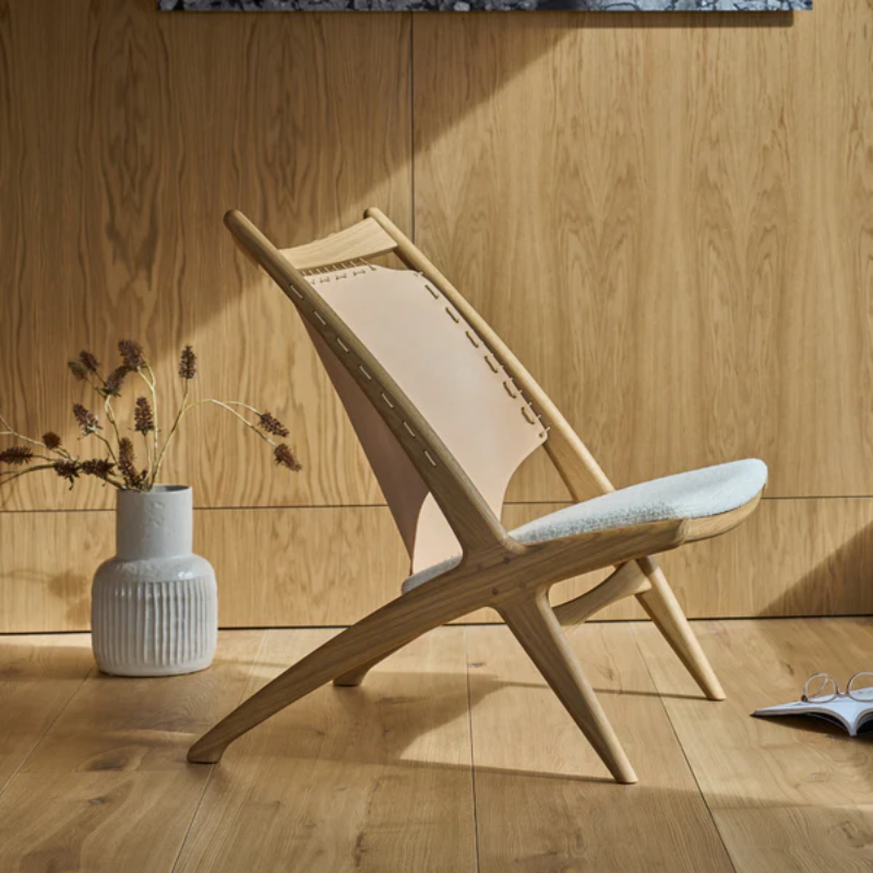 The Krysset Lounge Chair from Eikund of Norway in a living room.