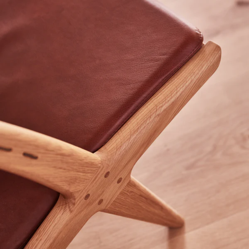 The Krysset Lounge Chair from Eikund of Norway in a lounge.