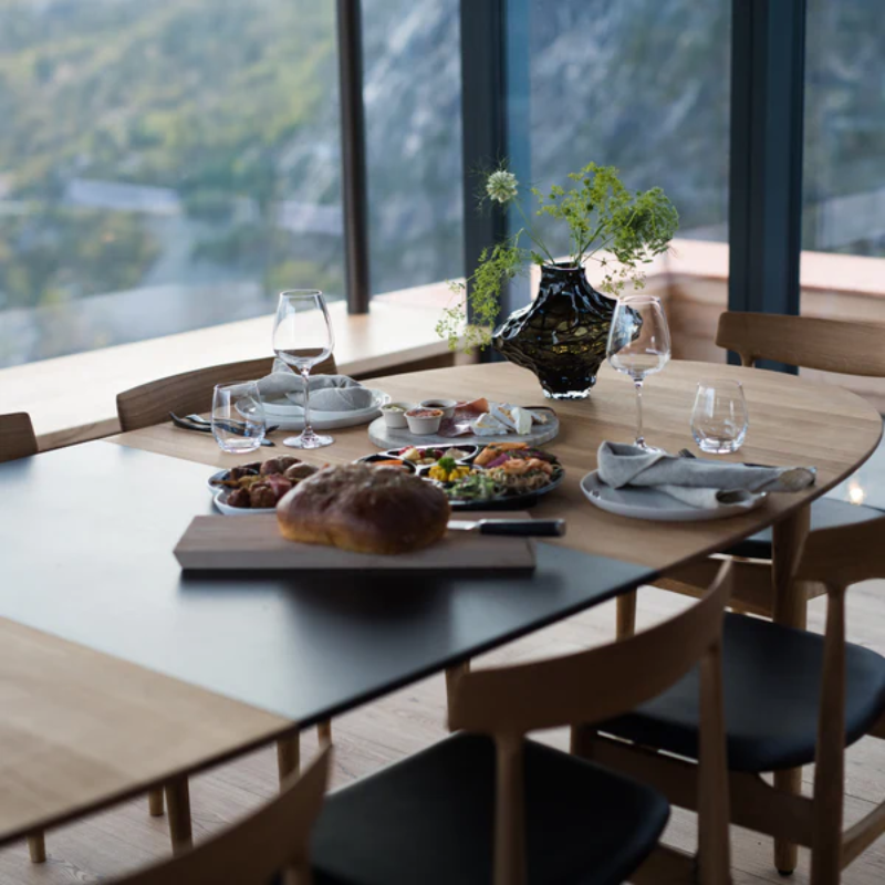 The Øya Dining Table from Eikund of Norway in a dining room.