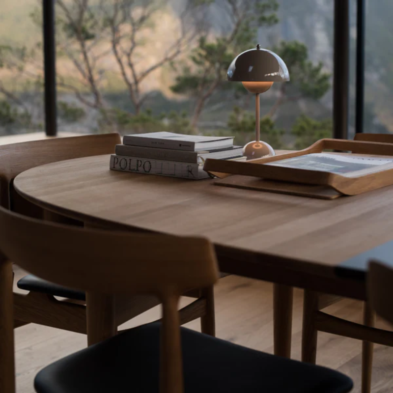 The Øya Dining Table from Eikund of Norway in a kitchen and dining set up.