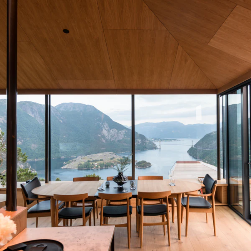 The Øya Dining Table from Eikund of Norway in a living room.
