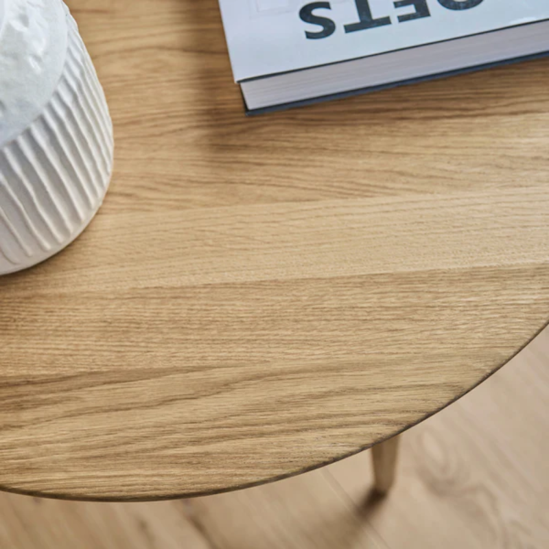 The Round Evja Coffee Table from Eikund of Norway in a living room.