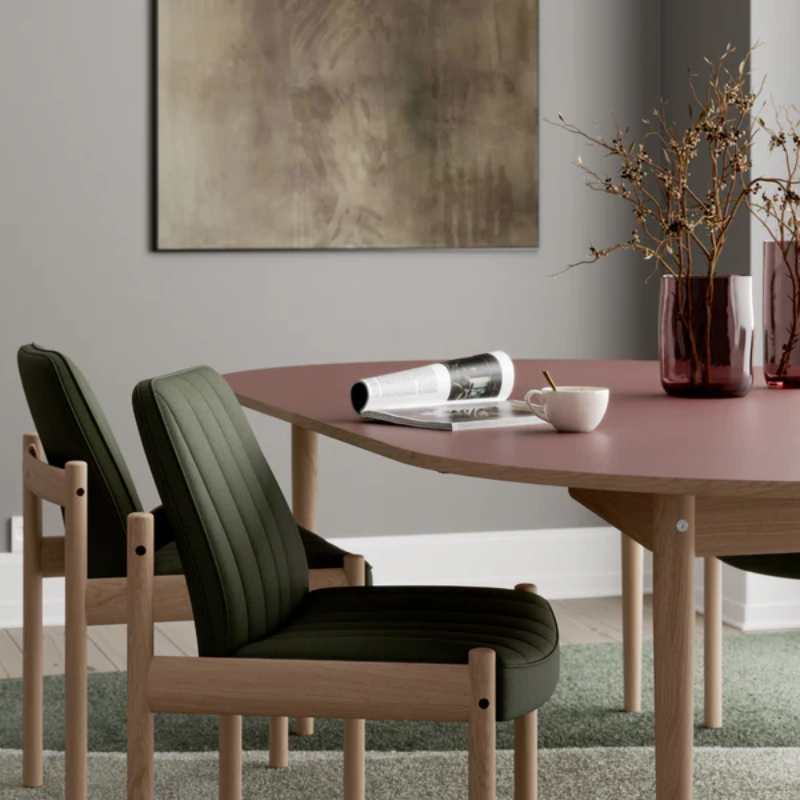 The Ry Armchair from Eikund of Norway in a lounge.