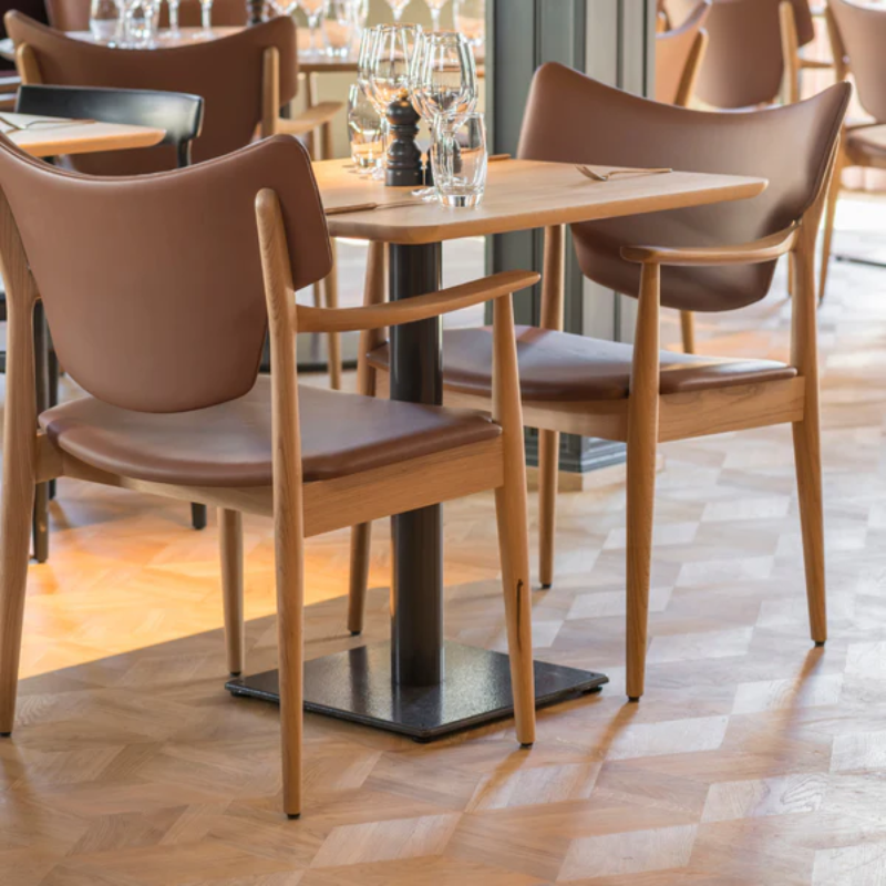 The Veng Armchair from Eikund of Norway in a dining room.