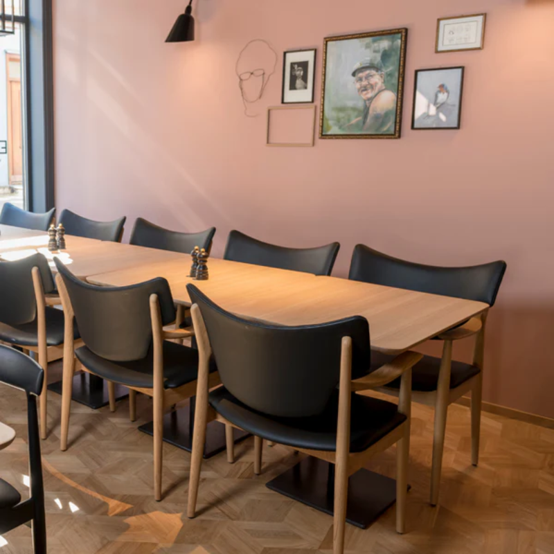 The Veng Armchair from Eikund of Norway in a lounge.