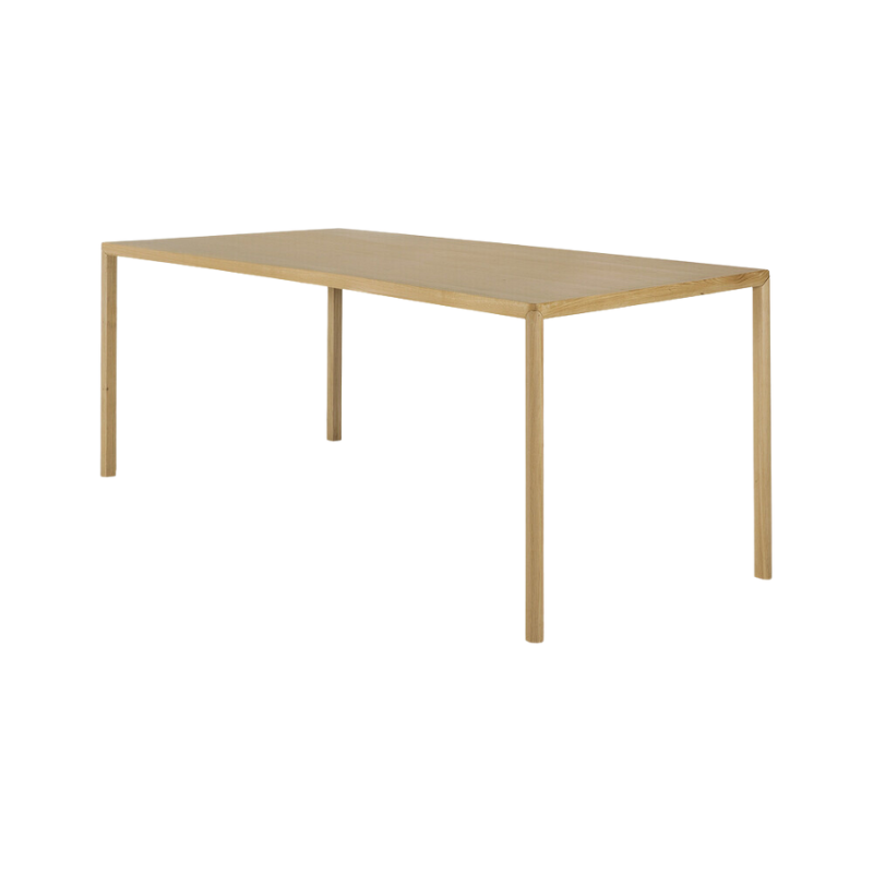 The Air Dining Table from Ethnicraft in the 63 inch size from a side angle.
