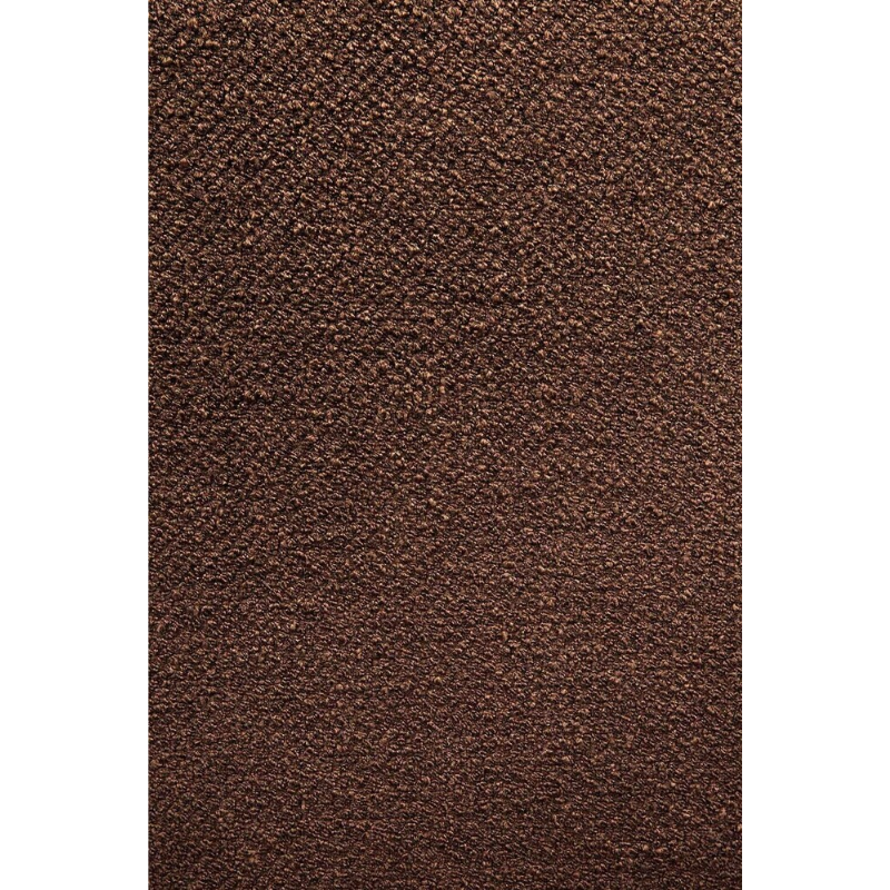 A close up showing the copper fabric option of the Barrow Lounge Chair from Ethnicraft.