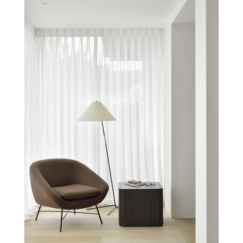 The Barrow Lounge Chair from Ethnicraft in a study space.