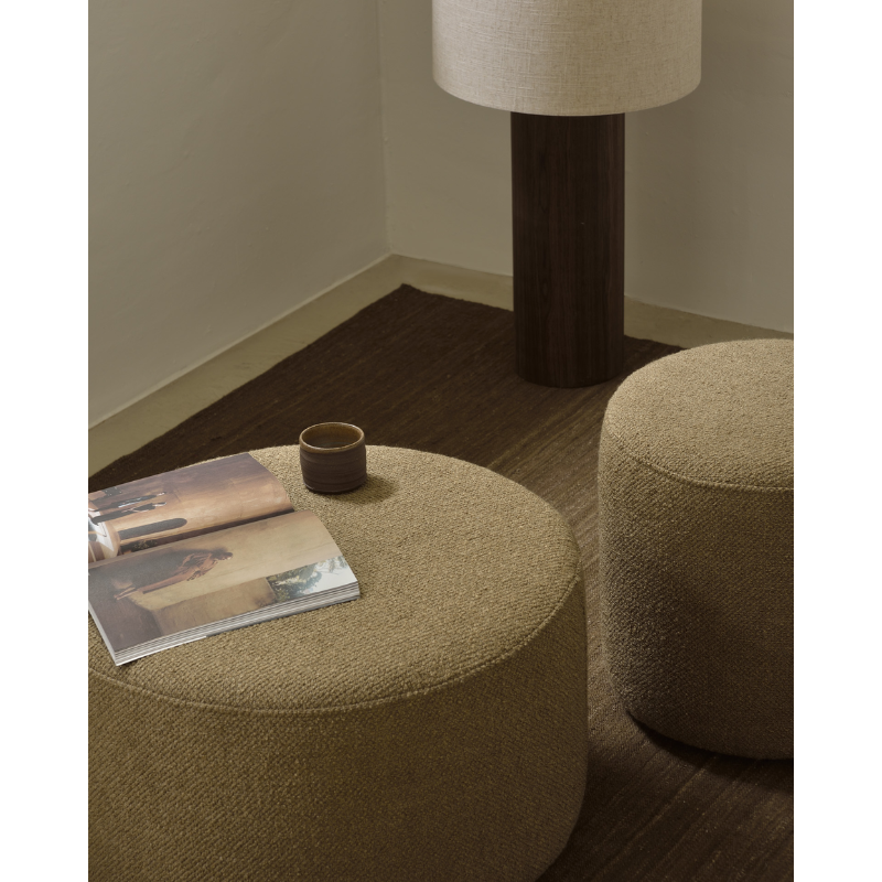 The Barrow Pouf by Ethnicraft in a living room lifestyle shot, showing the detail of the fabric in a home setting.