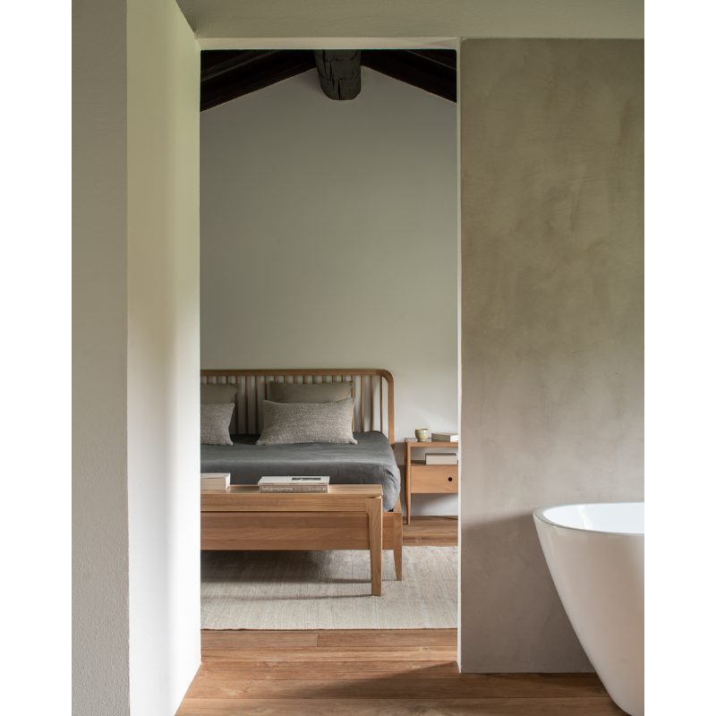 The Bok Bench from Ethnicraft in a bedroom.