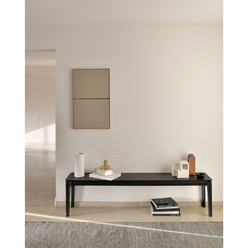 The Bok Bench from Ethnicraft in an entryway.