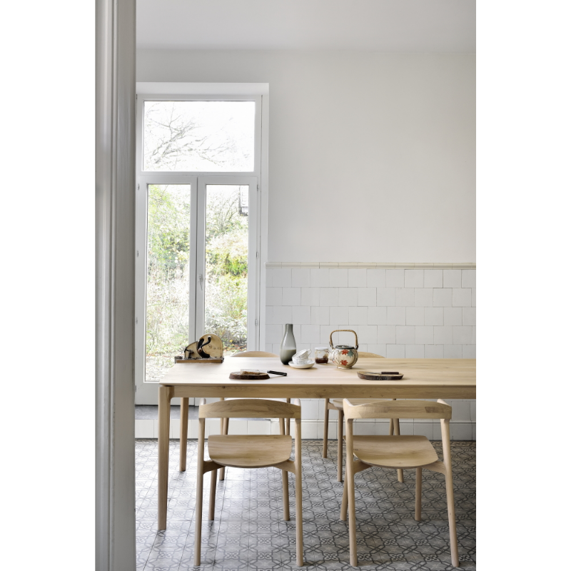 The Bok Dining Chair from Ethnicraft in a dining room.