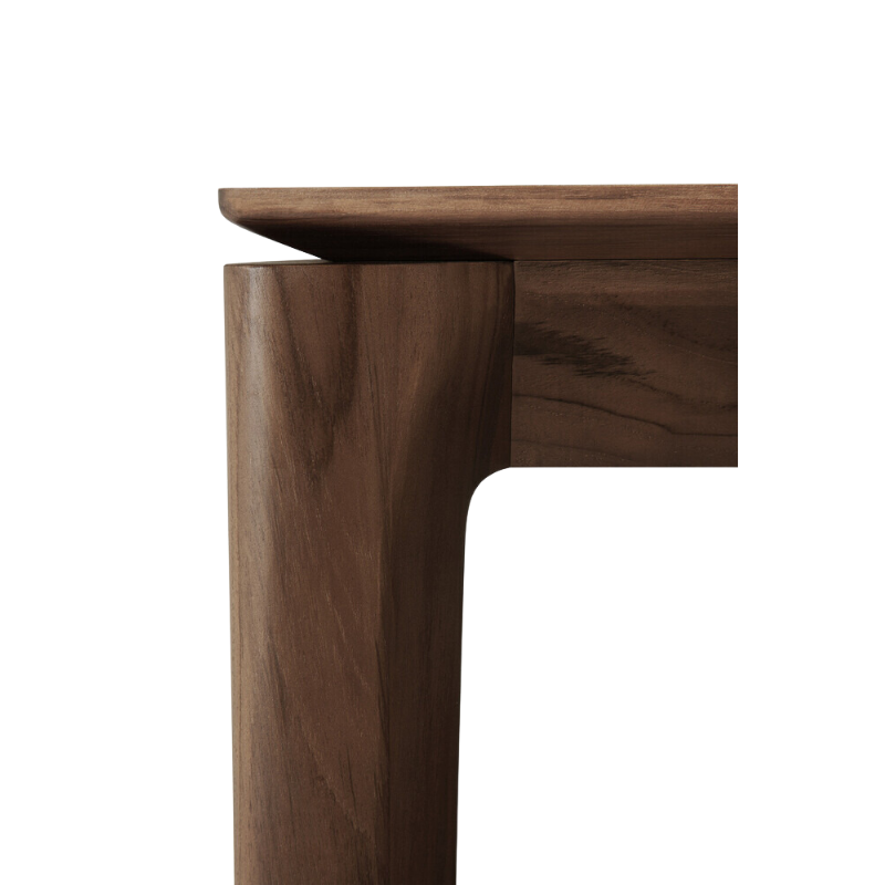 The Bok Dining Table from Ethnicraft in brown teak, close up.