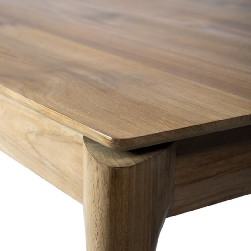 The Bok Dining Table from Ethnicraft in teak, in a detailed close up shot.