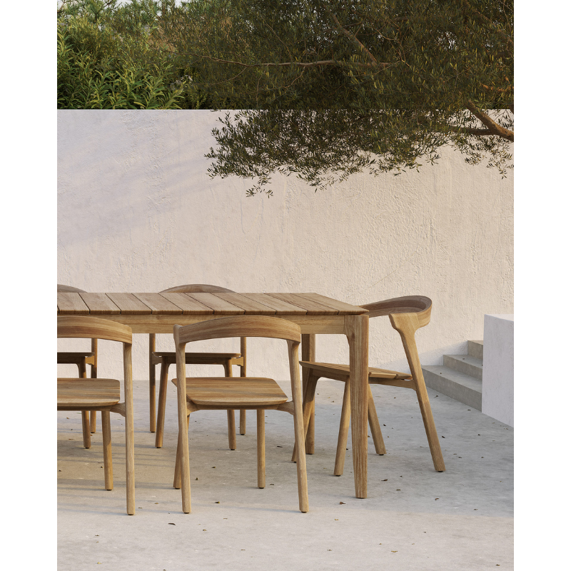 The Bok Outdoor Dining Chair from Ethnicraft outdoors with the Bok Dining Table.