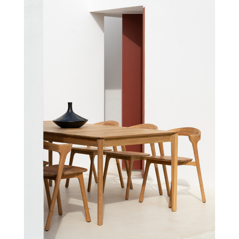 The Bok Outdoor Dining Chair from Ethnicraft in an outdoor lounge area.