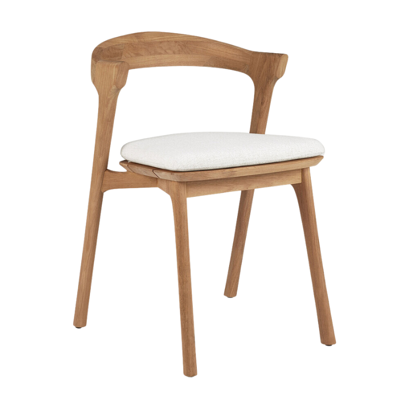 The Bok Outdoor Dining Chair from Ethnicraft in teak with a cushion in off white color.