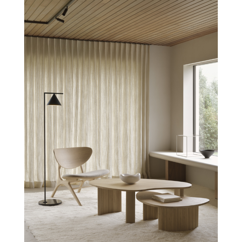 The Boomerang Coffee Table from Ethnicraft in a home office lifestyle photograph.