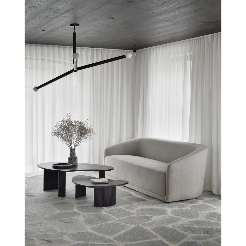 The Boomerang Coffee Table from Ethnicraft in a living room.