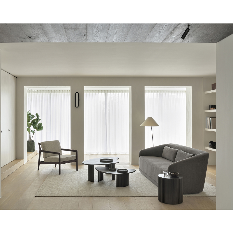 The Boomerang Coffee Table from Ethnicraft within a living space.