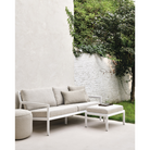The Boucle Square Outdoor Cushion from Ethnicraft in an outdoor family space.
