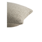 The Boucle Square Outdoor Cushion from Ethnicraft in oat in a detailed photograph.