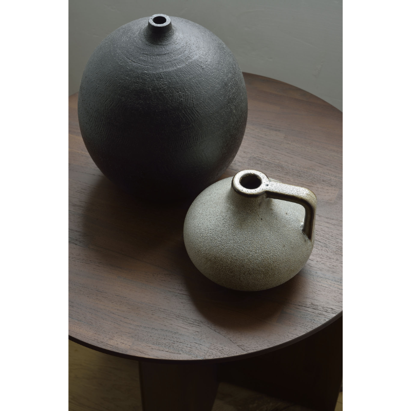 The Geometric Side Table from Ethnicraft in a close up shot showing the detail of the tabletop.