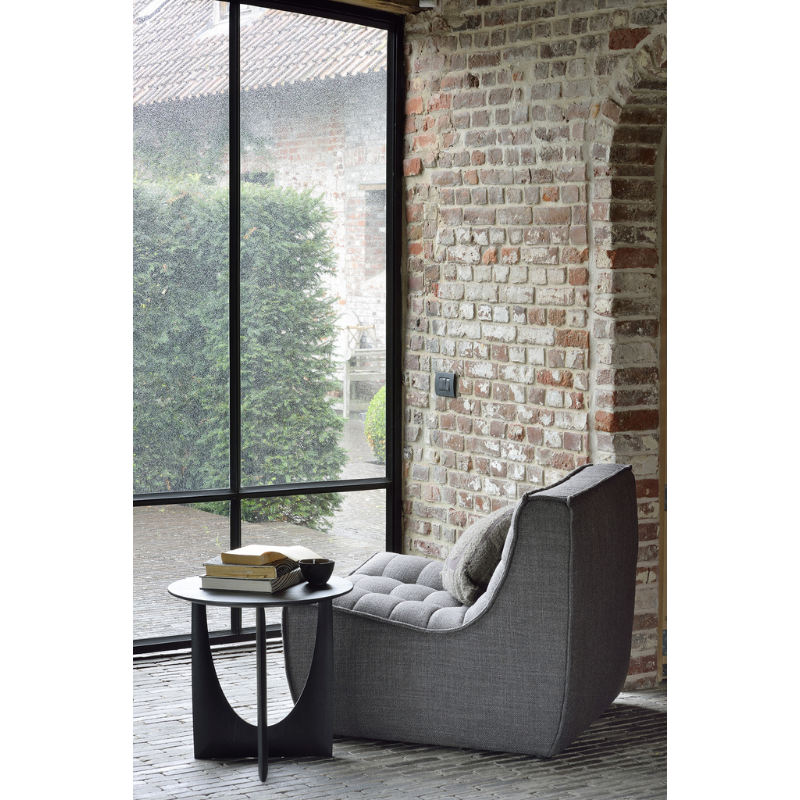 The Geometric Side Table from Ethnicraft in a lounge.