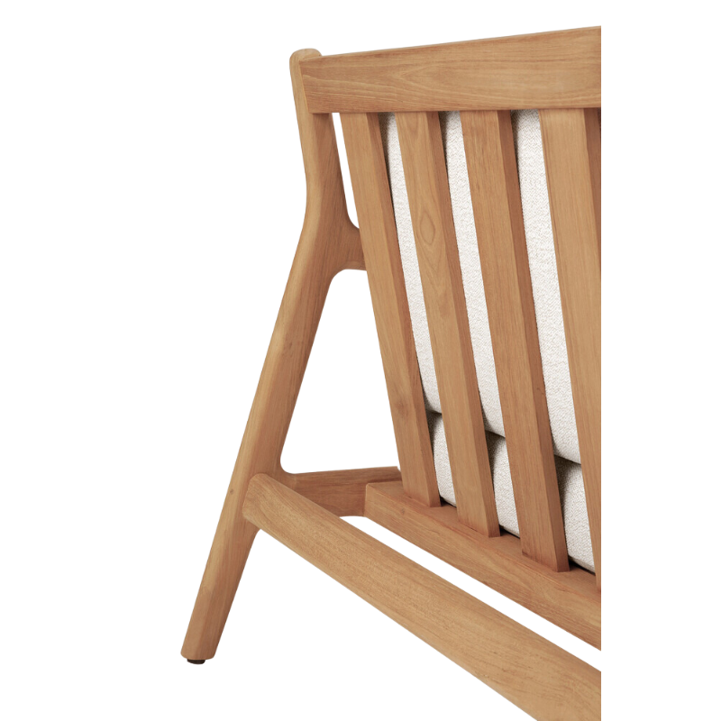 The Jack Outdoor Lounge Chair from Ethnicraft made from solid teak with the off white cushion.