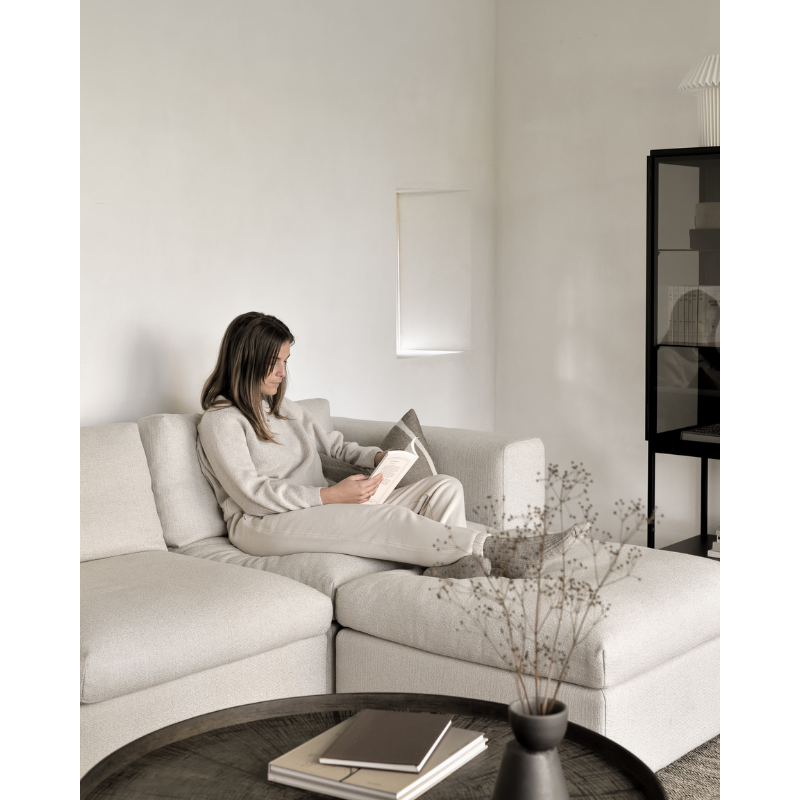 The Mellow Footstool from Ethnicraft in a lounge.