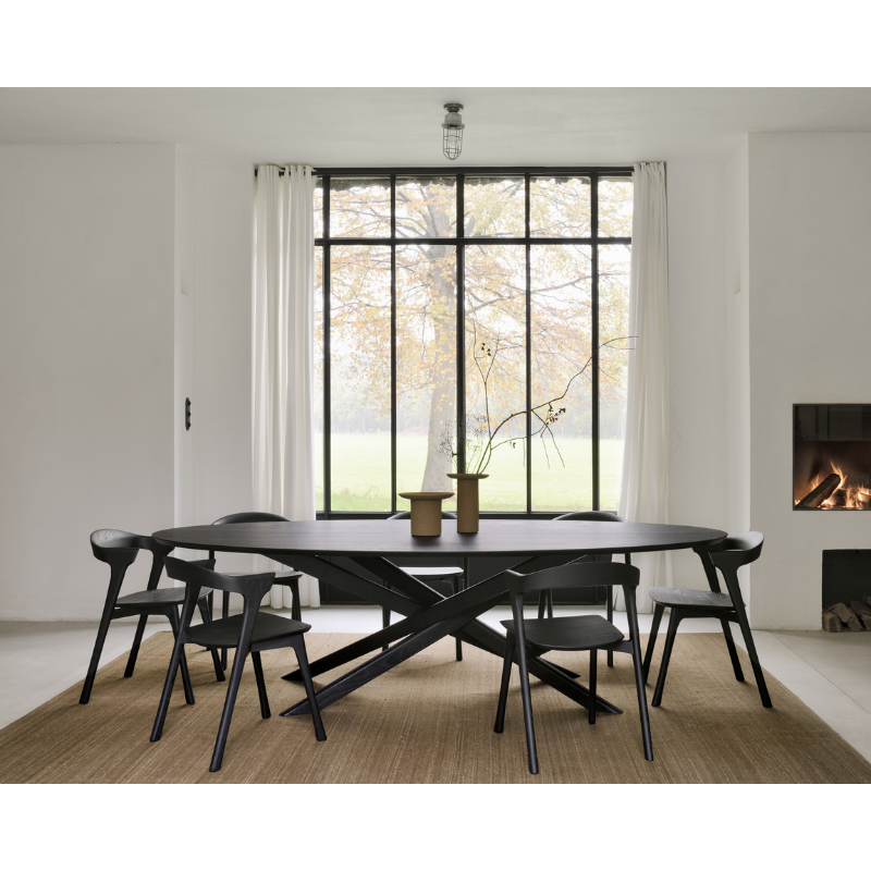 The Mikado oval dining table, designed by Alain van Havre, has been one of our most recognizable designs for years. Its sculptural character is the result of a quest to find a balance between functionality and stability. Mikado’s legs interlock like a well-thought-out puzzle. By exchanging the rectangular tabletop with an ellipse, we increase togetherness and connection. It's easier to interact with your guests, allows you to converse with everyone, and seats over a dozen people comfortably.