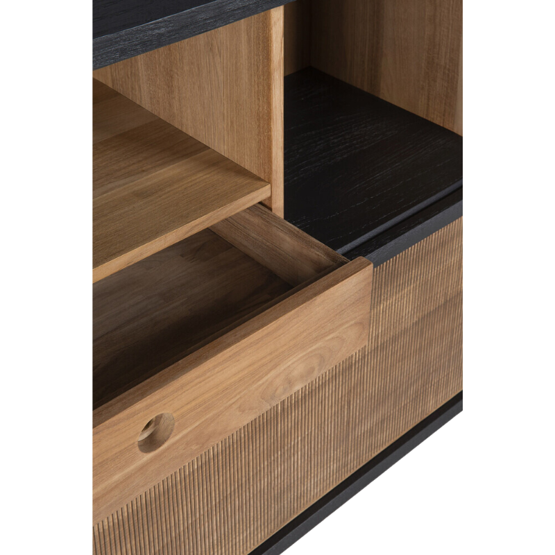 The Oscar sideboard in solid teak by Alain van Havre is the perfect multi-tasker: its open spaces can be used to exhibit personal objects, whereas the sliding doors offer the option of organizing documents out of sight. Notice the exceptional grooves in the doors: each narrow groove was carefully hand carved, making every Oscar piece unique.