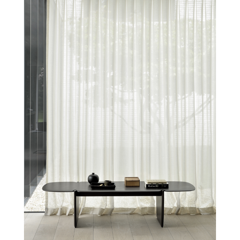 The PI Coffee Table from Ethnicraft decorating a hallway.