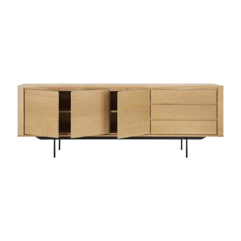 The Shadow sideboard is straightforward and robust with decisive lines. This more recent design with black metal legs, giving the design room to breathe, elevates this sideboard to new heights.