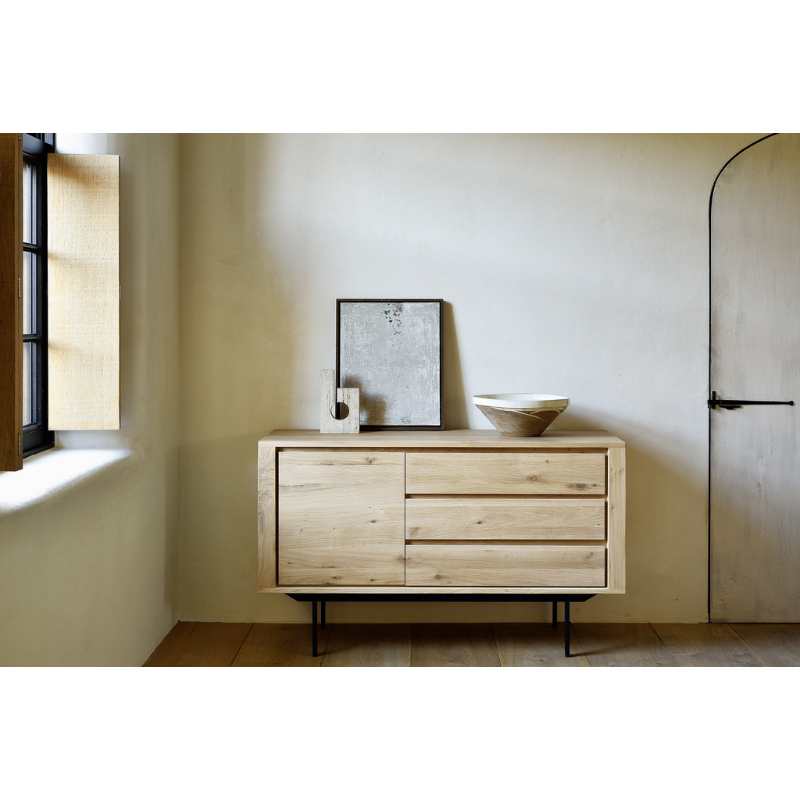 The Shadow sideboard is straightforward and robust with decisive lines. This more recent design with black metal legs, giving the design room to breathe, elevates this sideboard to new heights.