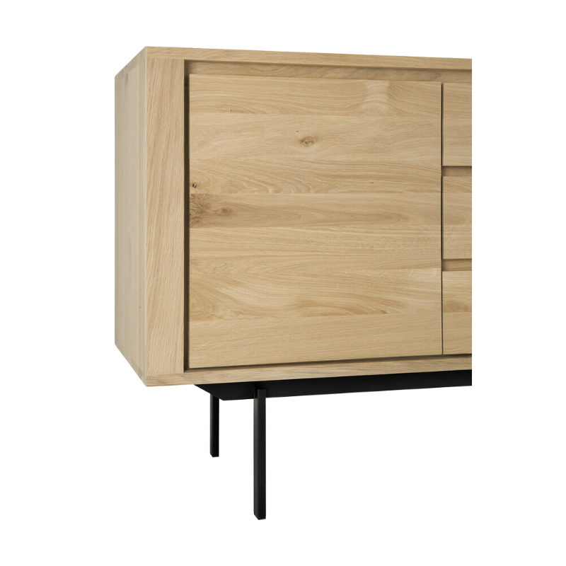 The Shadow sideboard is straightforward and robust with decisive lines. This more recent design with black metal legs, giving the design room to breathe, elevates this sideboard to new heights.