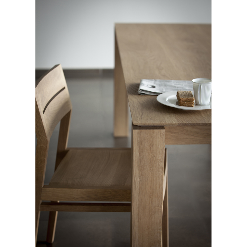 A seemingly simple and straightforward piece, the Slice dining table's subtle corner details add playful sophistication to the functional piece.