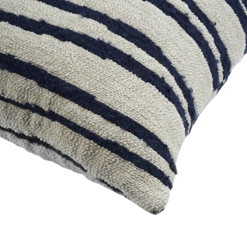 The Stripes Cushion from Ethnicraft in a close up shot.