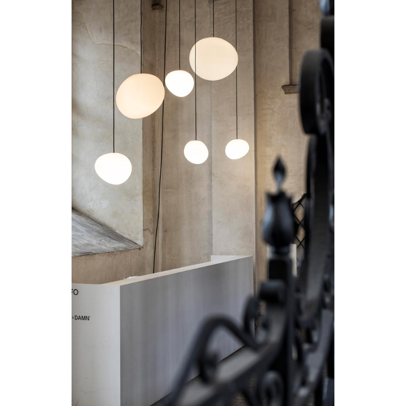 The Gregg Outdoor Pendant from Foscarini in a lounge.