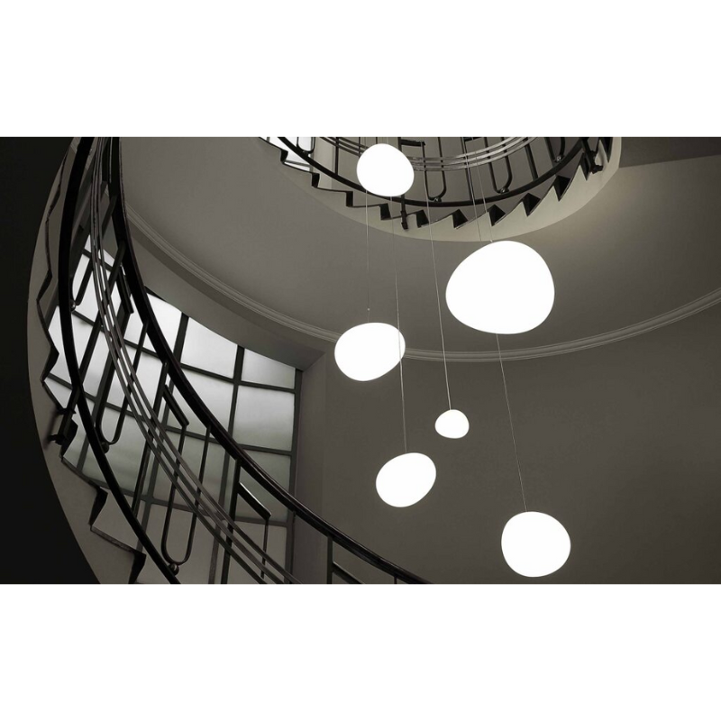 The Gregg Pendant from Foscarini in a living room.